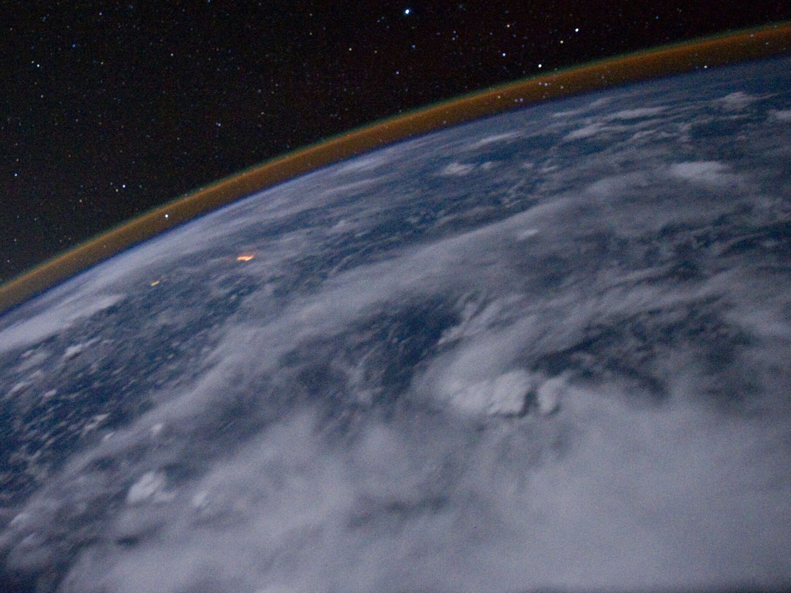 Earth's limb and thin upper atmosphere seen from orbit at night